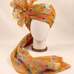 Front view of mustard multicolour floral print barati safa showing the patterned wrap and fan