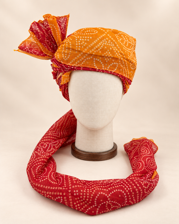 Front view of mustard rust bandhani print Barati Safa showing the mustard crown and rust red patterned tail