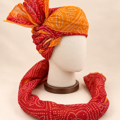 Right side view of mustard rust bandhani print Barati Safa showing twisted folds and cream dotted fan