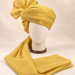 Front view of mustard yellow premium Barati Safa showing the plain woven wrap and broad fan