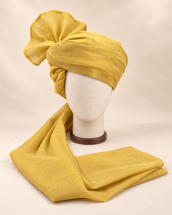 Front view of mustard yellow premium Barati Safa showing the plain woven wrap and broad fan