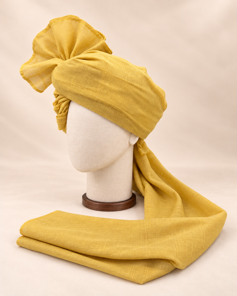 Left side view of mustard yellow premium Barati Safa showing the smooth wrap and long tail