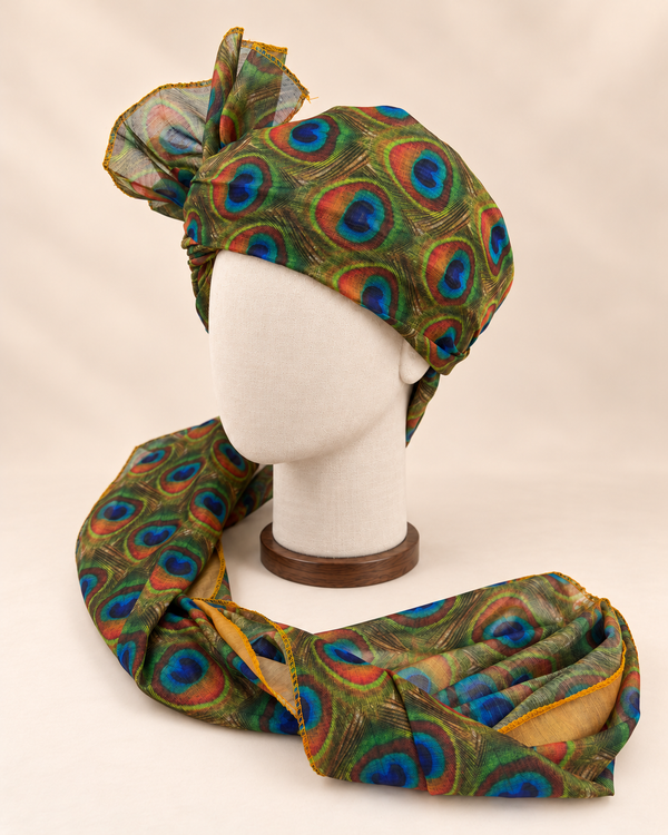 Left side view of olive green peacock feather print Barati Safa showing its wrap and mustard-edged tail