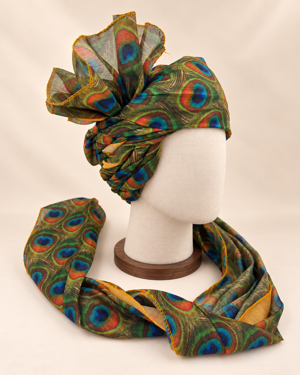Right side view of olive green peacock feather print Barati Safa showing twisted folds and fan