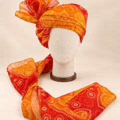 Front view of orange paisley bandhani print barati safa showing the patterned wrap and fan