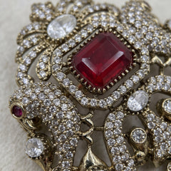 Red Ornamental Brooch with White Bead Drop, detail view