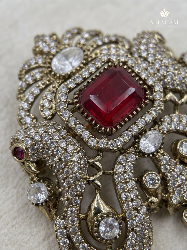 Red Ornamental Brooch with White Bead Drop, detail view