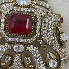 Red Ornamental Brooch with White Bead Drop, detail view