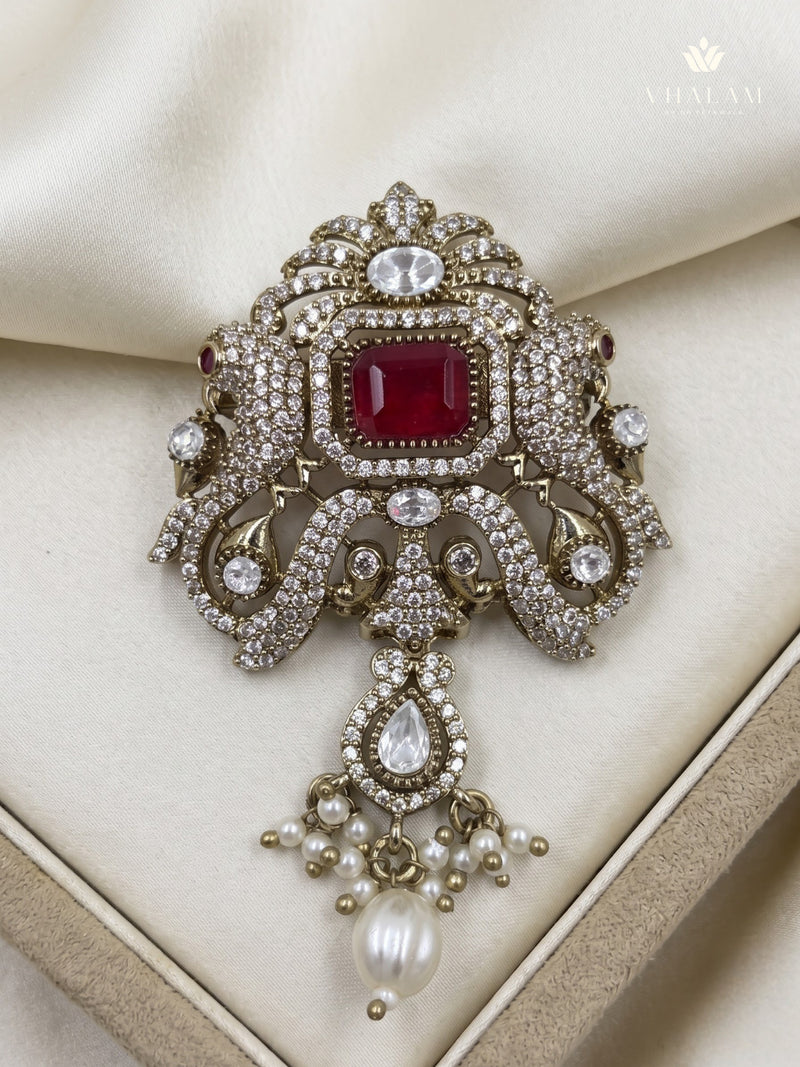 Red Ornamental Brooch with White Bead Drop, front view