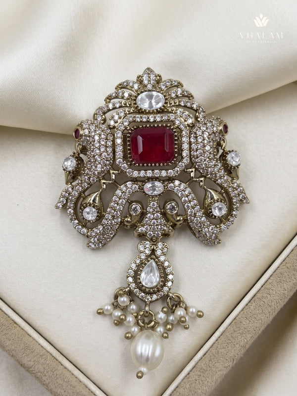 Red Ornamental Brooch with White Bead Drop, front view