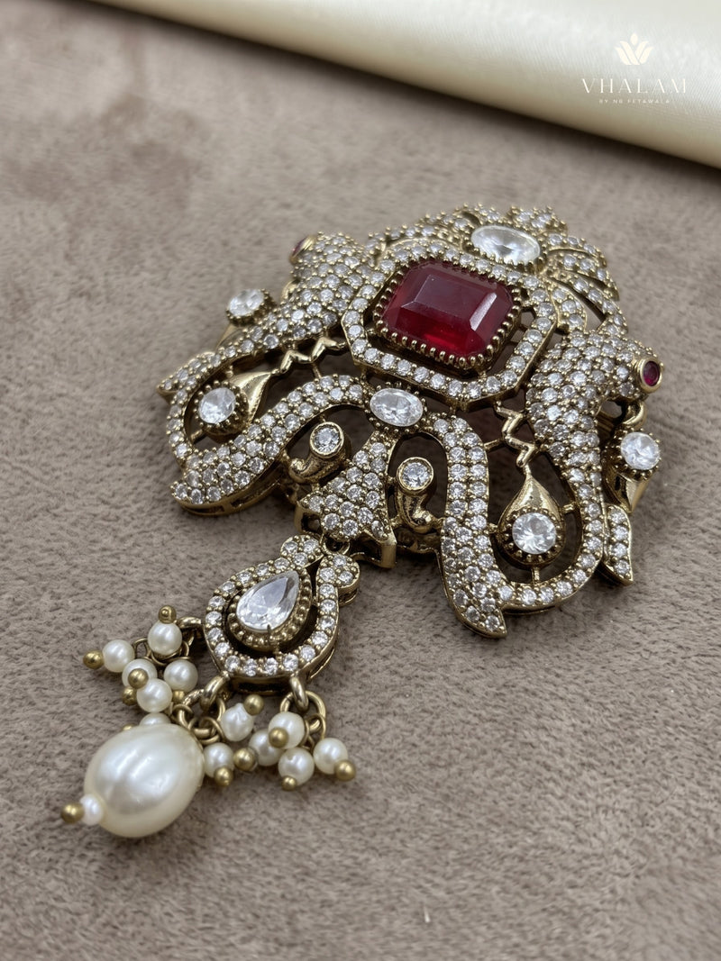 Red Ornamental Brooch with White Bead Drop, front view