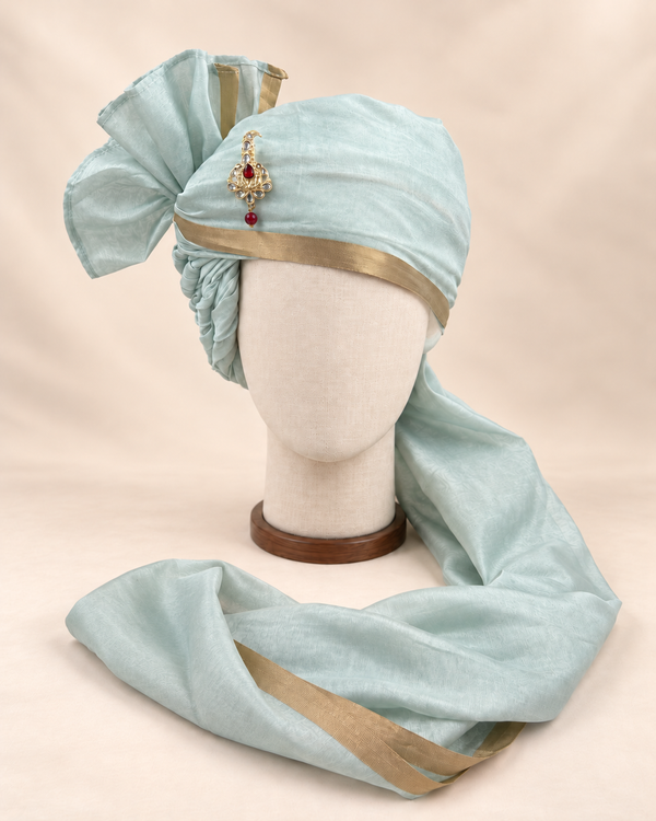 Front view of pale sage gold border premium barati safa showing the gold-tone border and broad fan
