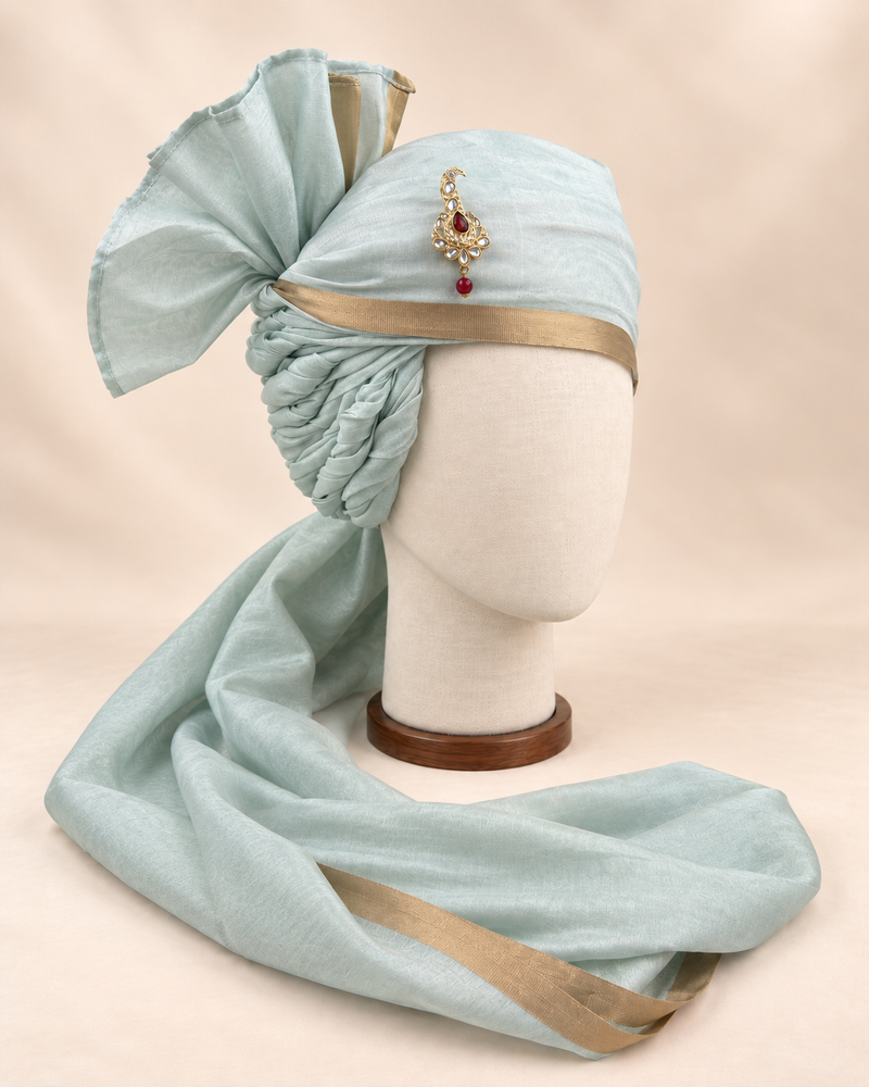 Right side view of pale sage gold border premium barati safa showing the twisted folds and fan detail