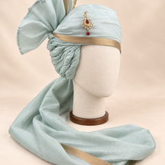 Right side view of pale sage gold border premium barati safa showing the twisted folds and fan detail