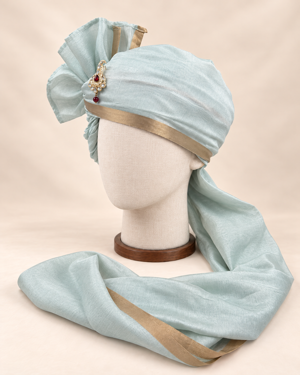 Left side view of pale sage gold border premium barati safa showing the smooth wrap and long bordered tail