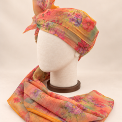 Left side view of pastel abstract floral print barati safa showing the smooth wrap and long patterned tail