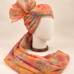 Right side view of pastel abstract floral print barati safa showing twisted folds and fan detail