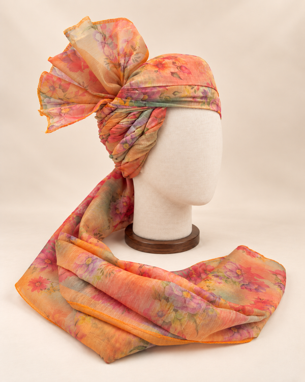Right side view of pastel abstract floral print barati safa showing twisted folds and fan detail