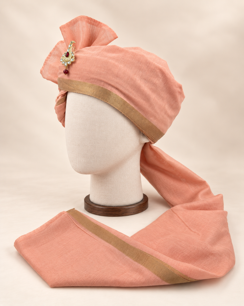 Left side view of peach gold border premium Barati Safa showing the smooth wrap and long bordered tail