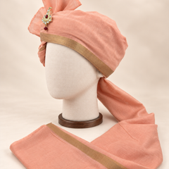 Left side view of peach gold border premium Barati Safa showing the smooth wrap and long bordered tail