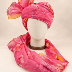 Front view of pink floral print barati safa showing the patterned wrap and fan