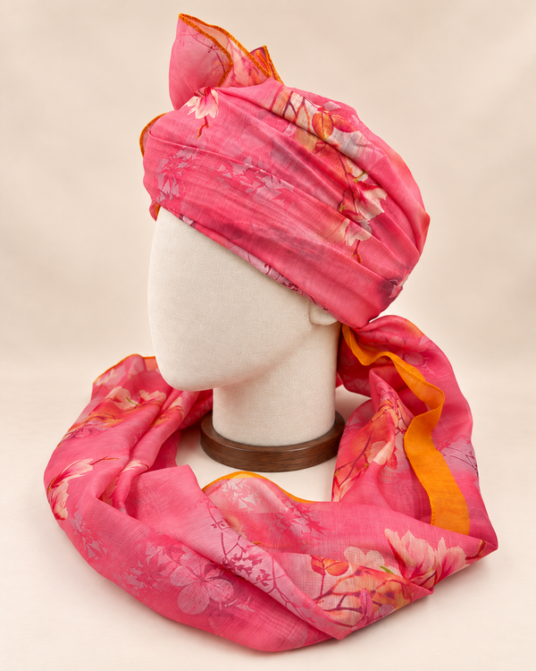 Left side view of pink floral print barati safa showing the smooth wrap and long patterned tail