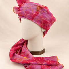 Left side view of pink lilac quatrefoil print Barati Safa showing its wrap and patterned tail
