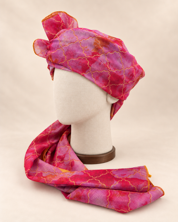 Left side view of pink lilac quatrefoil print Barati Safa showing its wrap and patterned tail