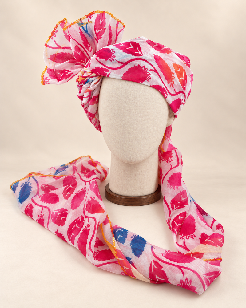 Front view of pink white leaf print Barati Safa with magenta leaves and blue and orange accents