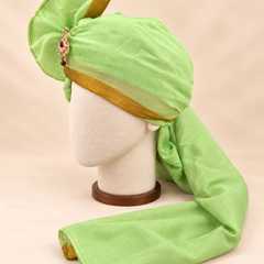 Left side view of pistachio green gold border premium barati safa showing the smooth wrap and long bordered tail