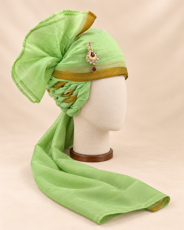 Right side view of pistachio green gold border premium barati safa showing twisted folds and fan detail