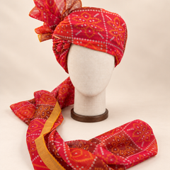 Front view of red diamond bandhani print barati safa showing the patterned wrap and fan