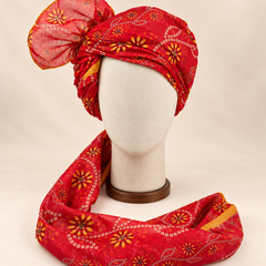 Front view of red floral bandhani Barati Safa with yellow flowers and cream square-dot chains