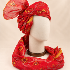 Right side view of red floral bandhani Barati Safa showing twisted folds and fan