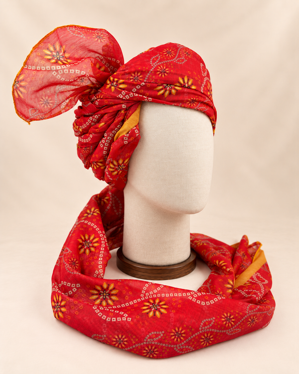 Right side view of red floral bandhani Barati Safa showing twisted folds and fan