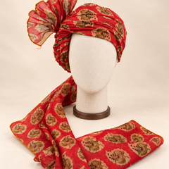 Front view of red floral medallion Barati Safa with cream and gold-tone flowers and brown maroon details