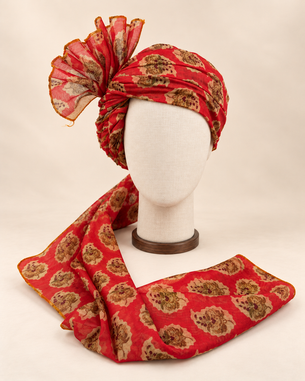 Front view of red floral medallion Barati Safa with cream and gold-tone flowers and brown maroon details