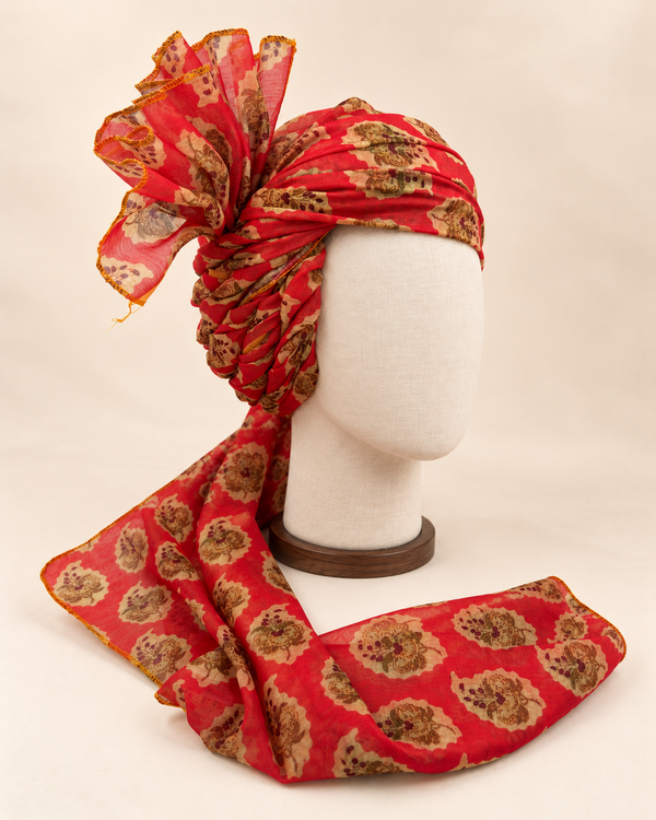 Right side view of red floral medallion Barati Safa showing twisted folds and fan