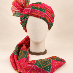 Front view of red green bandhani print barati safa showing the patterned wrap and fan