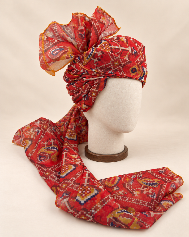 Right side view of red multicolour geometric print Barati Safa showing twisted folds and fan