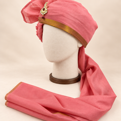 Left side view of rose pink gold border premium barati safa showing the smooth wrap and long bordered tail