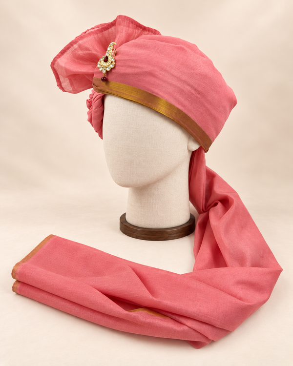 Left side view of rose pink gold border premium barati safa showing the smooth wrap and long bordered tail