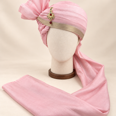 Front view of soft pink champagne border premium barati safa showing the champagne gold-tone border and angular fan