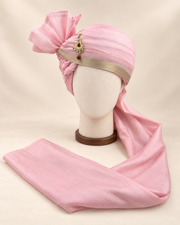 Front view of soft pink champagne border premium barati safa showing the champagne gold-tone border and angular fan