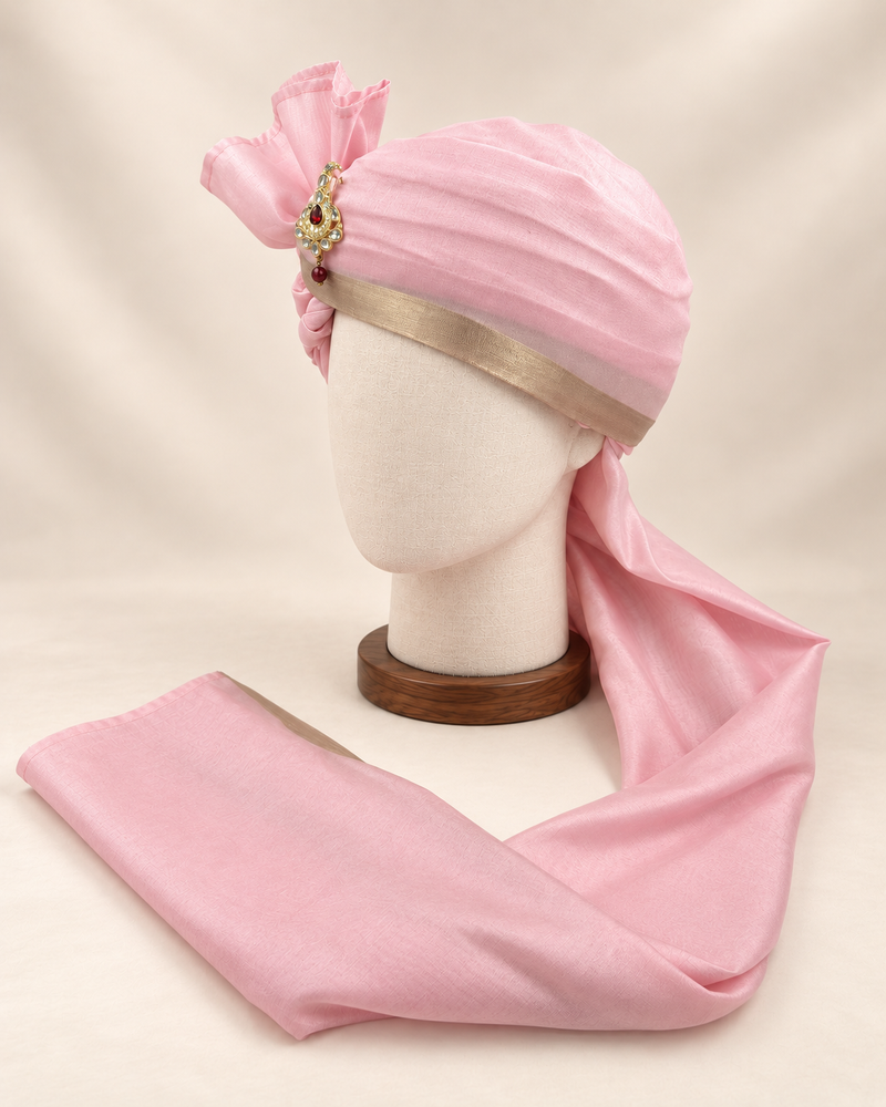 Left side view of soft pink champagne border premium barati safa showing the smooth wrap and long tail