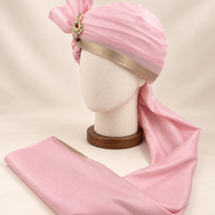 Left side view of soft pink champagne border premium barati safa showing the smooth wrap and long tail