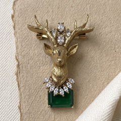 Gold-Tone Stag Head Brooch with Green Accent, front view