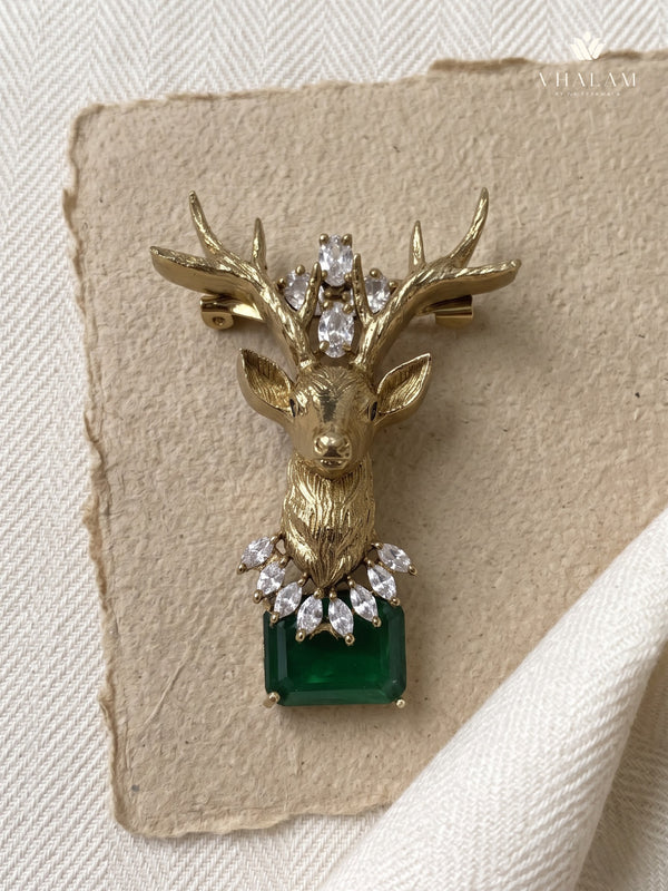 Gold-Tone Stag Head Brooch with Green Accent, front view