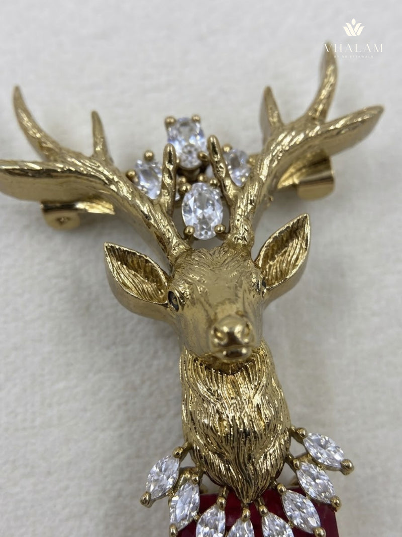 Gold-Tone Stag Head Brooch with Red Accent, detail view