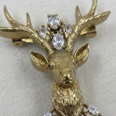 Gold-Tone Stag Head Brooch with Red Accent, detail view